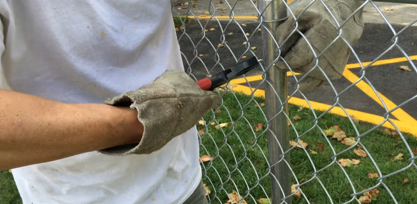 Chain-link fence installation by professional crew