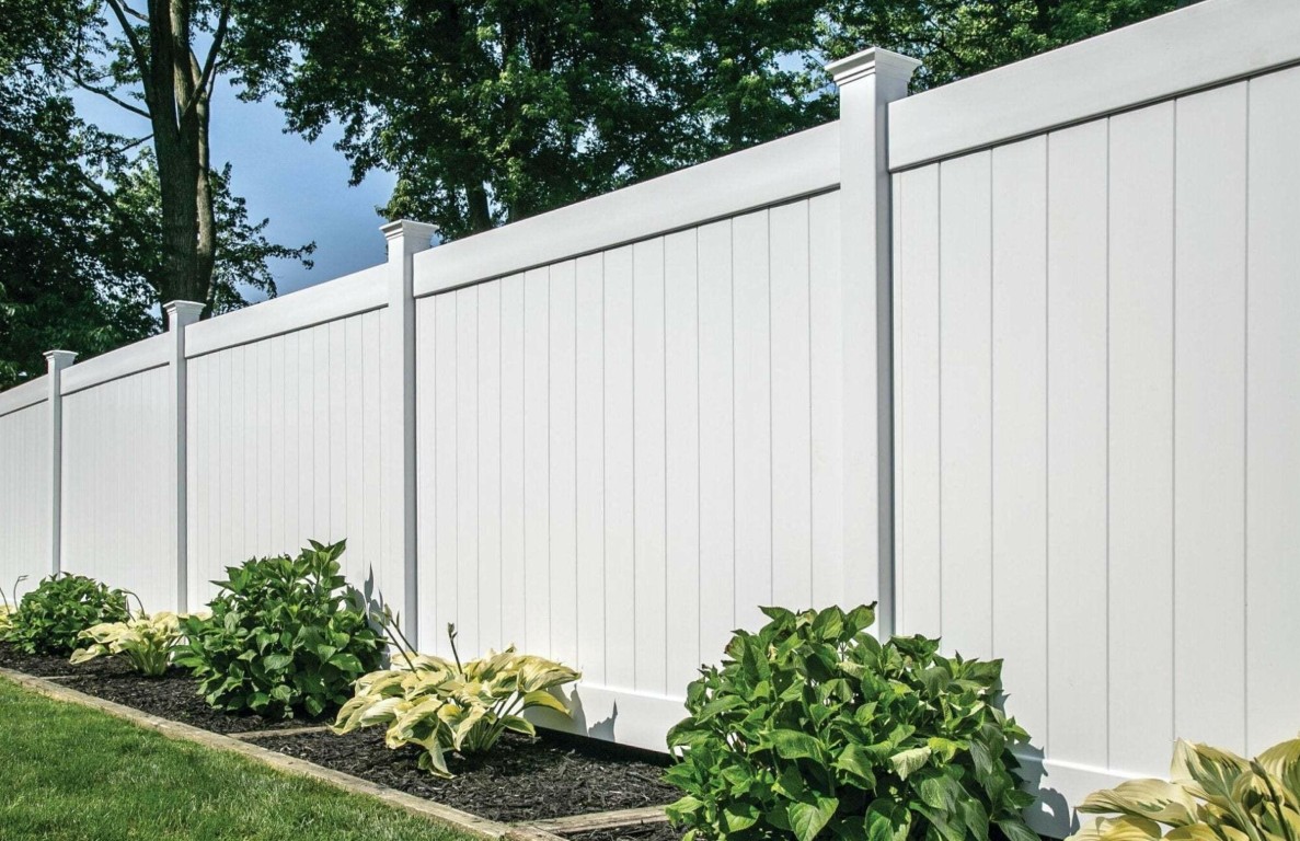 Durable white vinyl privacy fence installation